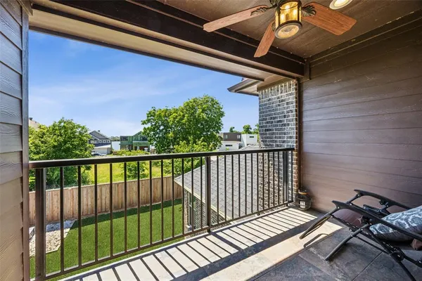 a view of balcony with wooden floor