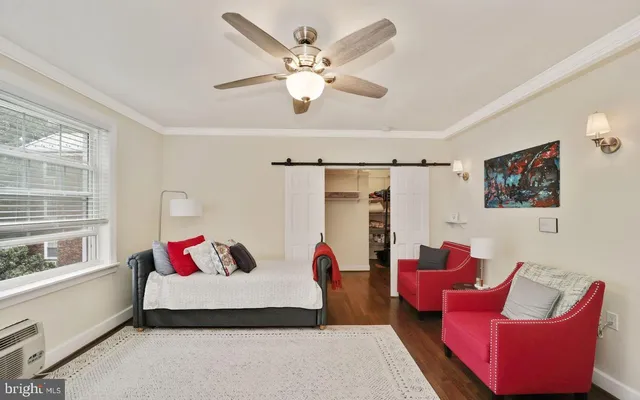 a bedroom with a bed and a couch