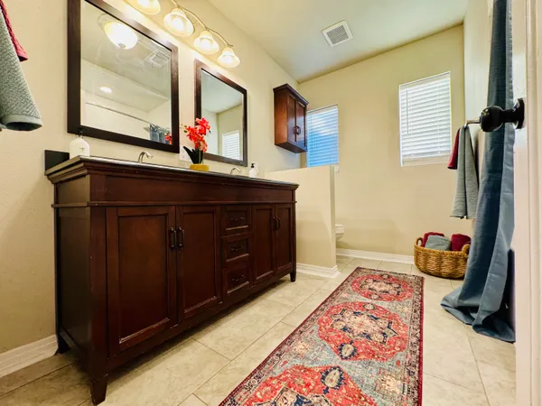 a room with a bed and a mirror