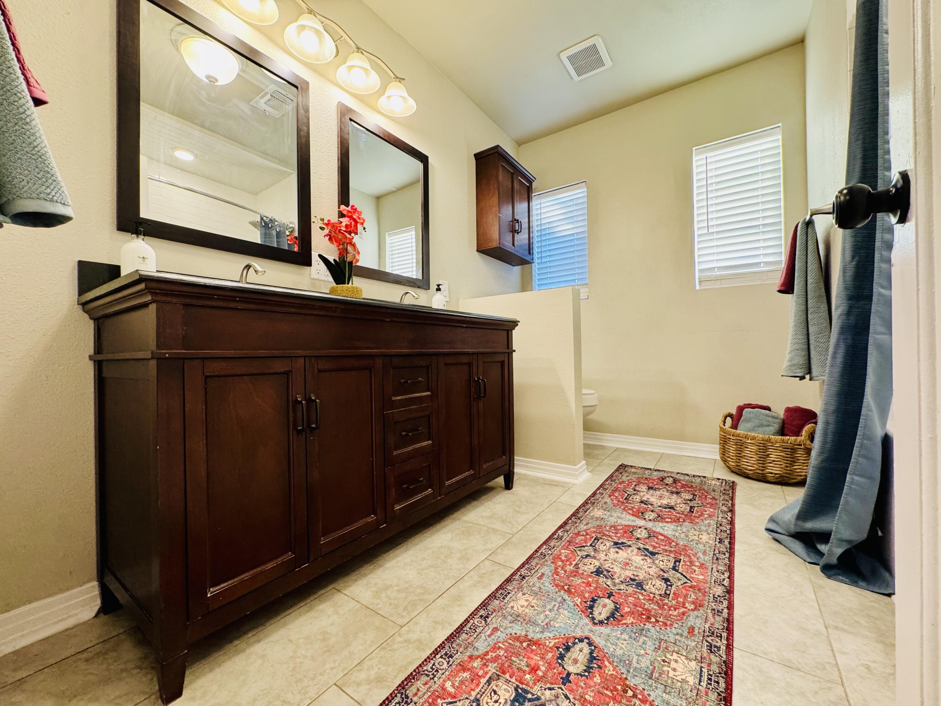 2509 30th Street Lubbock, TX 79410 - Photo 11 of 26 a room with a bed and a mirror