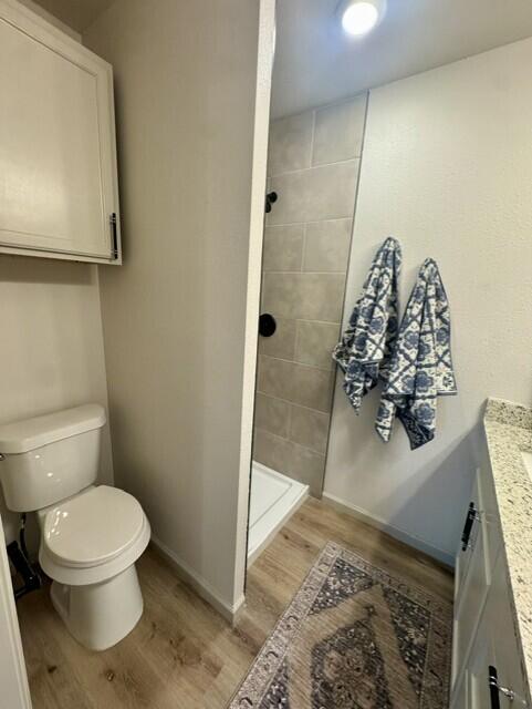 2509 30th Street Lubbock, TX 79410 - Photo 24 of 31 a bathroom with a toilet and shower
