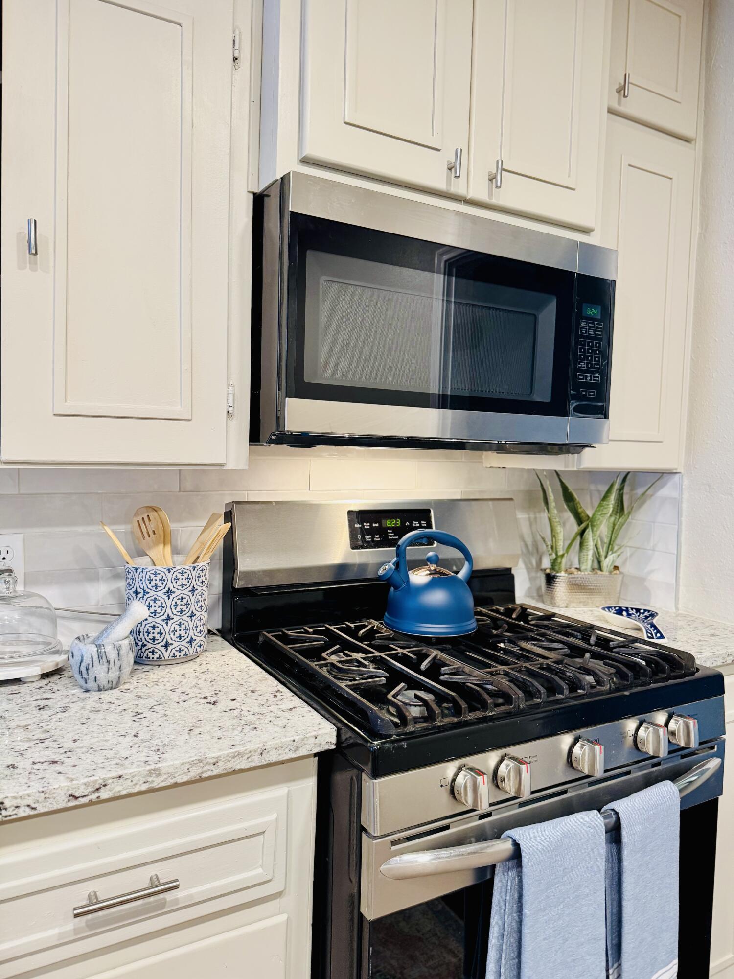 2509 30th Street Lubbock, TX 79410 - Photo 5 of 26 a stove top oven sitting inside of a kitchen