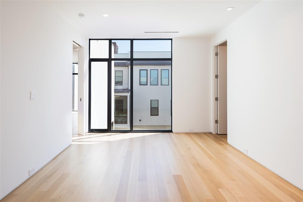 3515 Edgewater Street Dallas, TX 75205 - Photo 33 of 40 a view of an empty room with wooden floor and a window