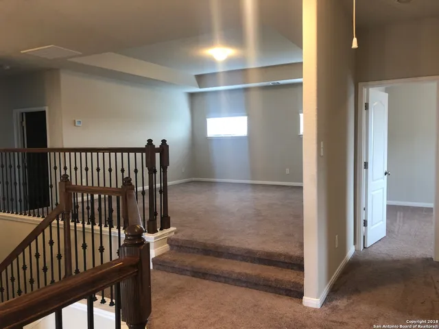 a view of staircase with white walls