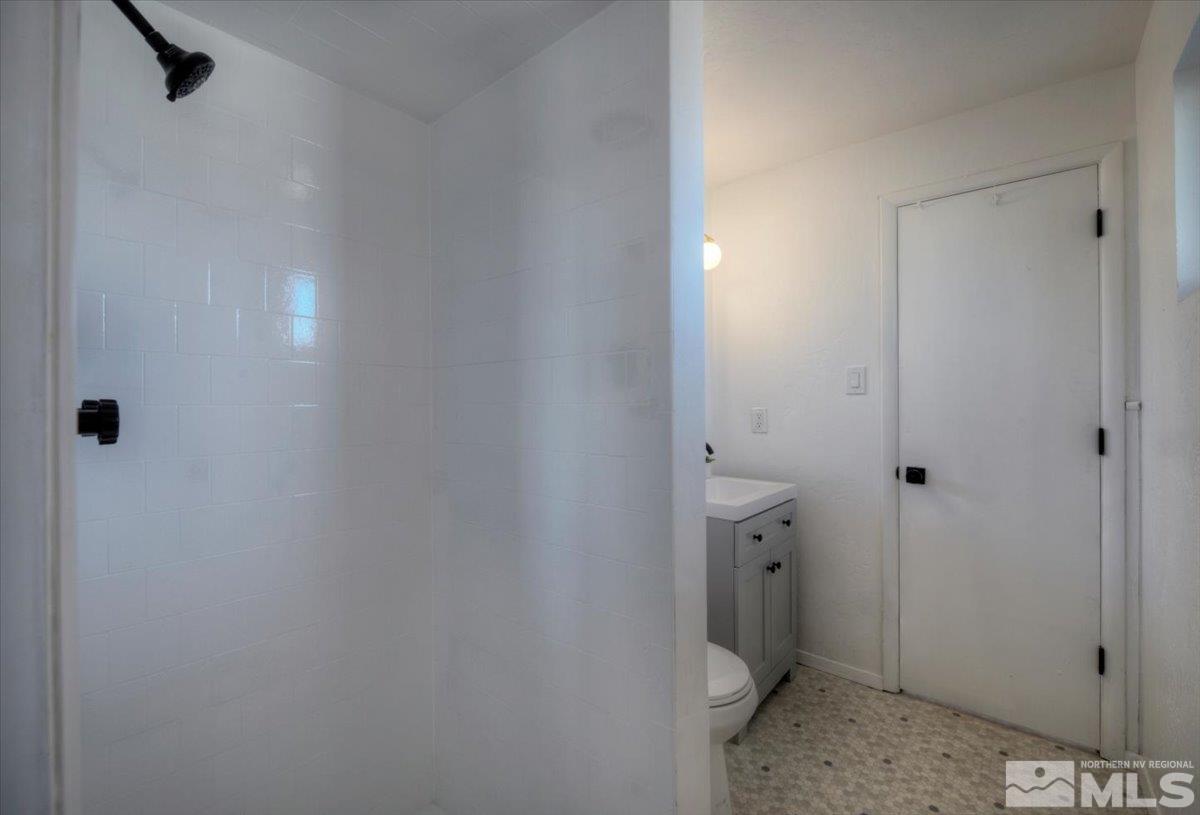 965 Grandview Avenue Reno, NV 89503 - Photo 17 of 34 a bathroom with a granite countertop sink and toilet