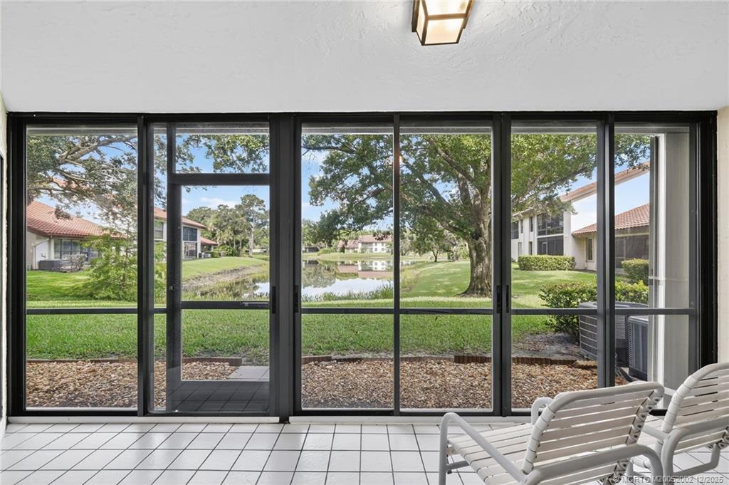 3460 Southeast Martinique Trace, Unit 103 Stuart, FL 34997 - Photo 23 of 42 a view of a large window with an outdoor space