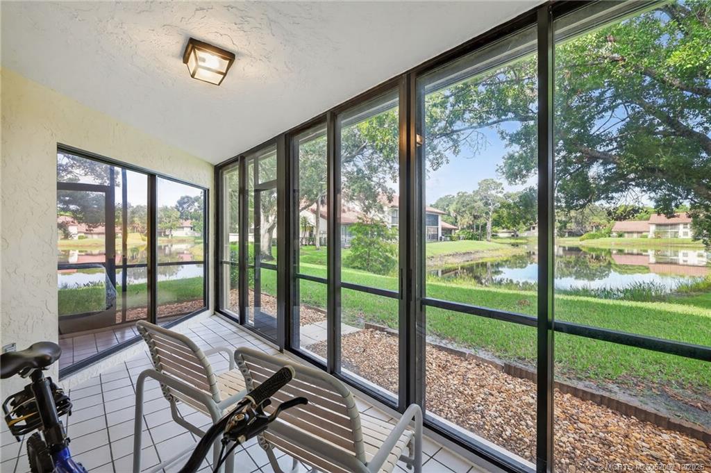 3460 Southeast Martinique Trace, Unit 103 Stuart, FL 34997 - Photo 24 of 42 a view of a city from a balcony