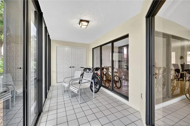 a view of a hallway with living room and furniture