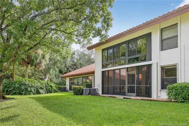 a view of a house that has a garden
