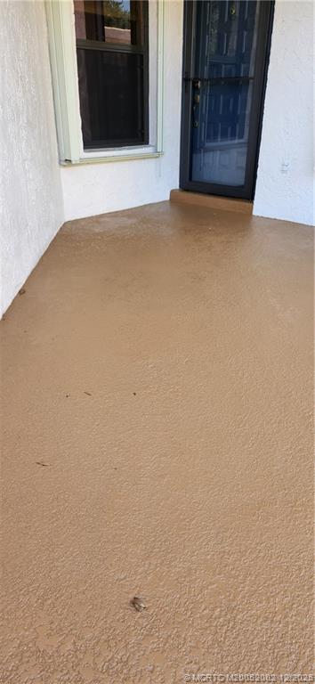 3460 Southeast Martinique Trace, Unit 103 Stuart, FL 34997 - Photo 4 of 42 a view of an empty room with a window