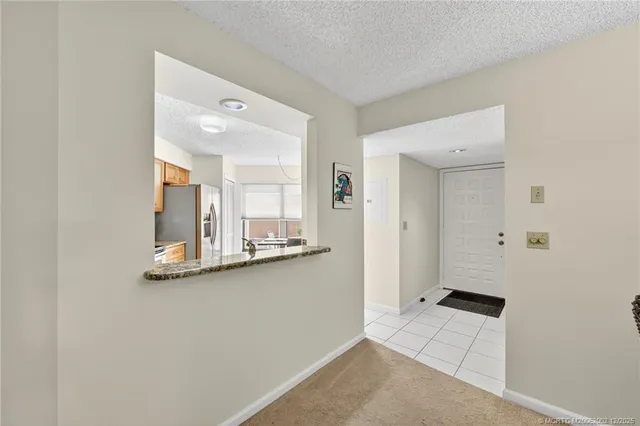 a view of a kitchen with wooden floor