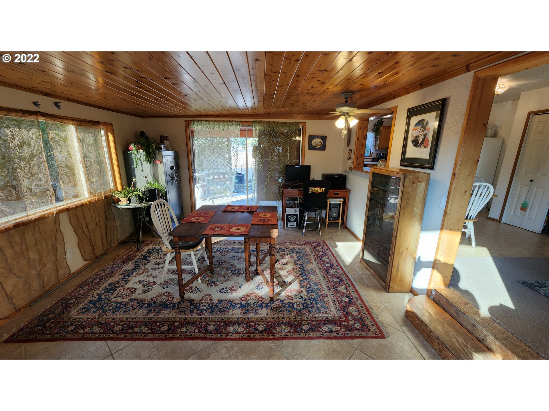 5208 Riddle Bypass Road Riddle, OR 97469 - Photo 11 of 37 a living room with furniture rug and wooden floor