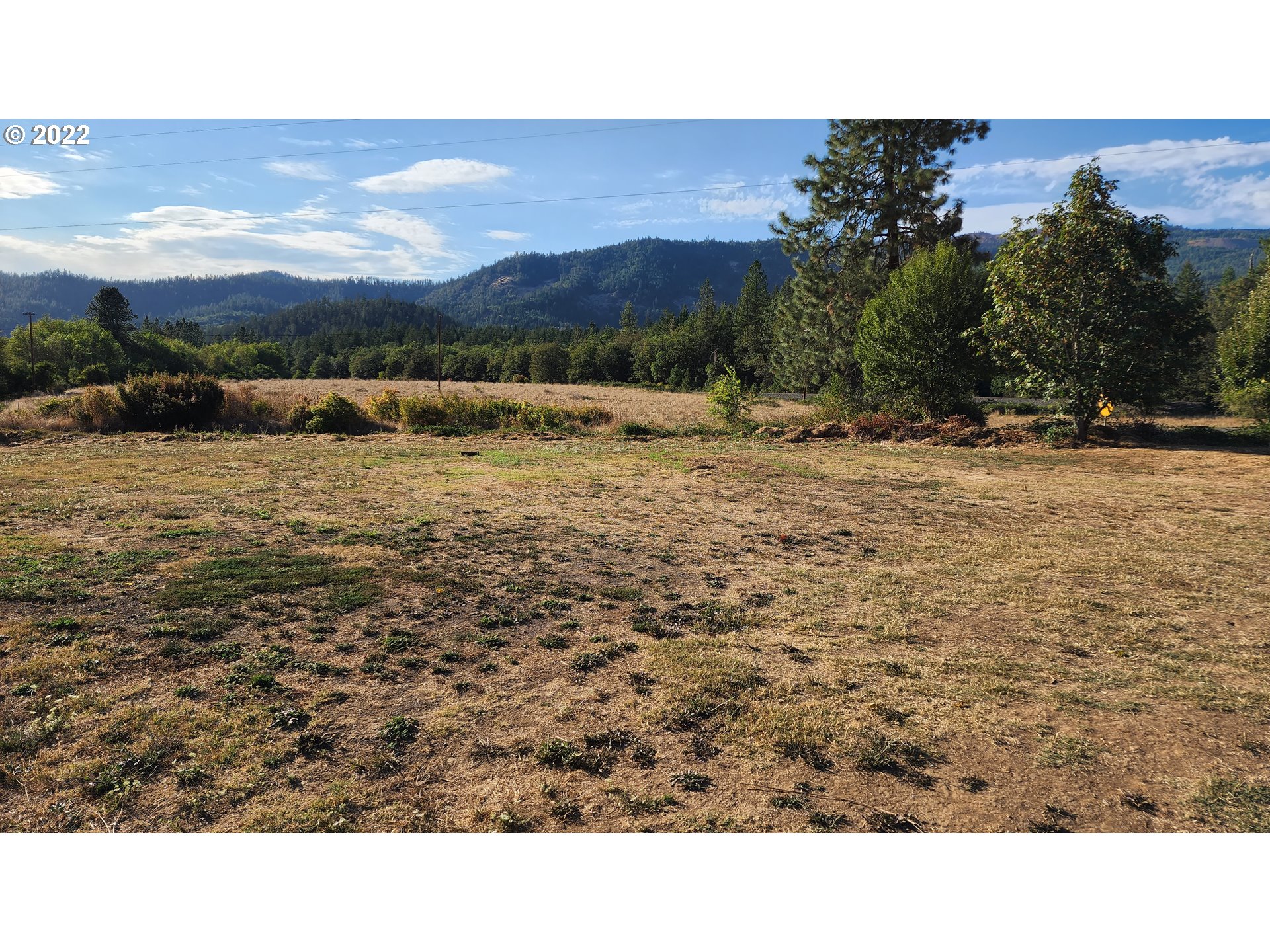 5208 Riddle Bypass Road Riddle, OR 97469 - Photo 22 of 37 a open area with mountains in the background
