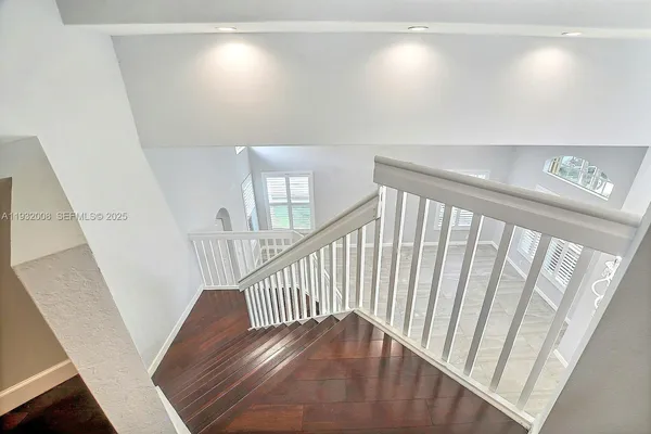 a view of a livingroom with wooden floor