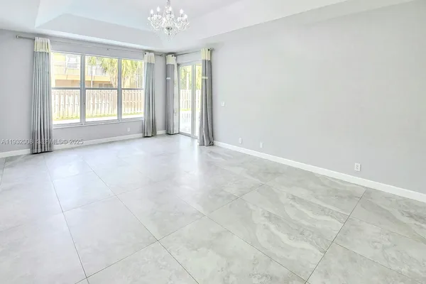 a spacious bathroom with a bathtub and toilet