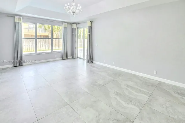 a spacious bathroom with a bathtub and toilet