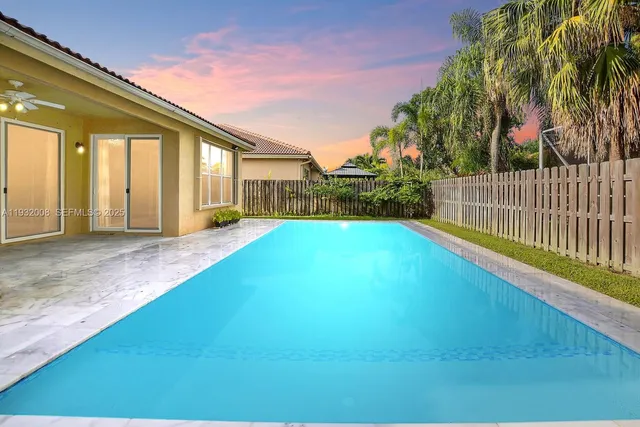 a sign that is sitting in front of flowers