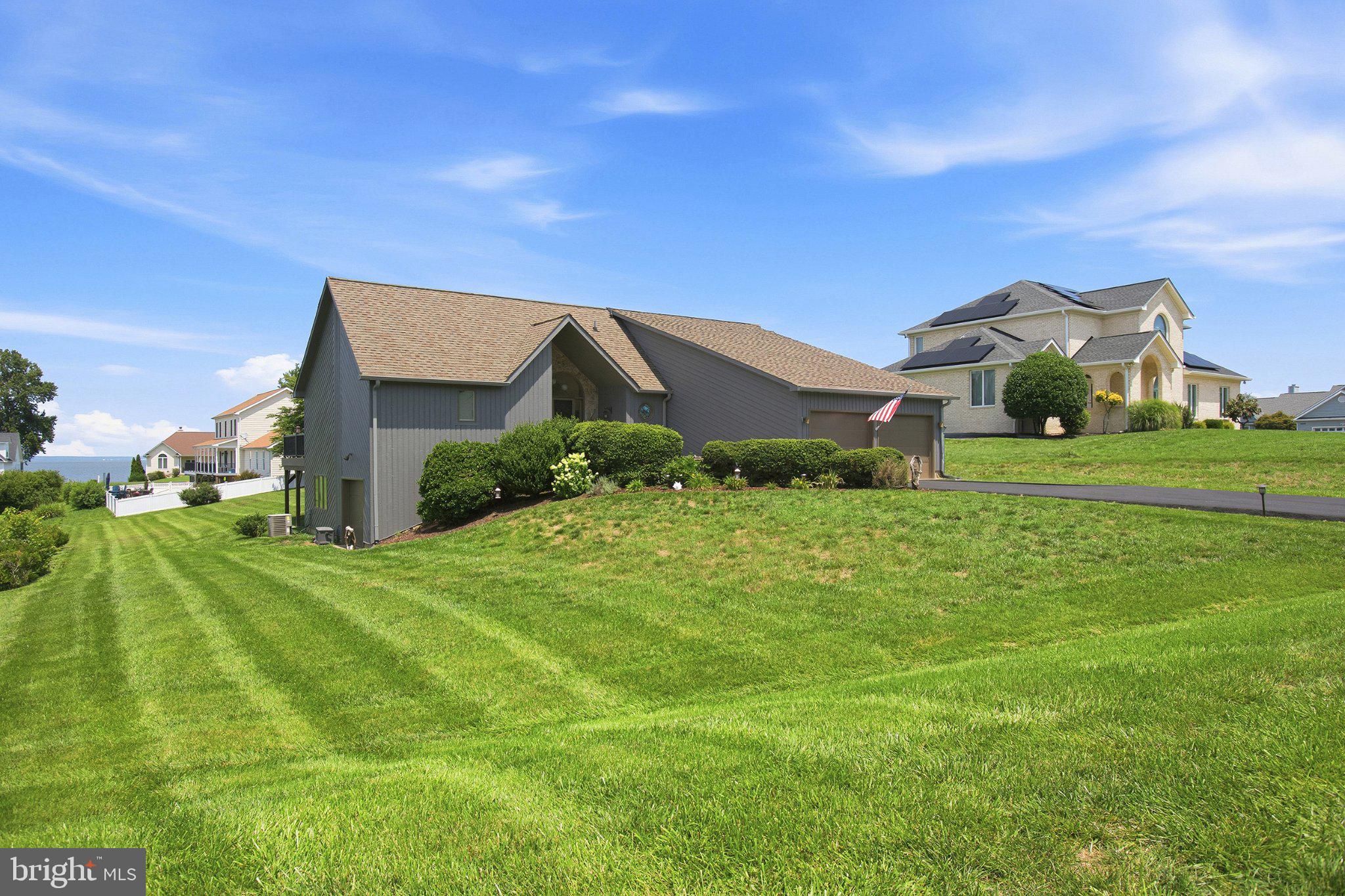 6495 Tides Road King George, VA 22485 - Photo 47 of 65 a front view of a house with a yard