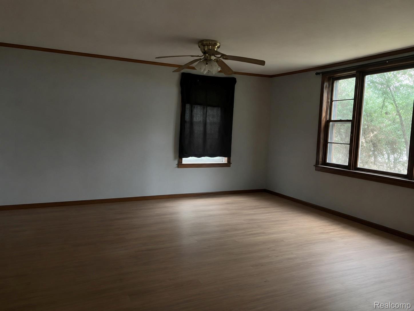 14677 West Carleton Road Hudson, MI 49247 - Photo 4 of 5 Spacious room featuring light wood-finish flooring and light gray walls