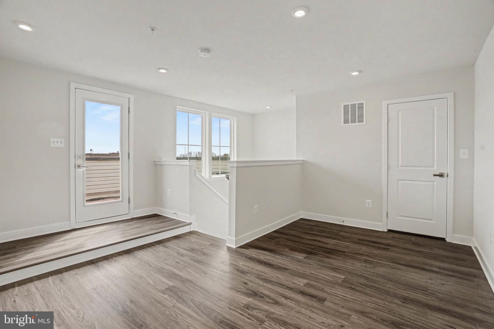 1518 Decatur Street, Unit C Baltimore, MD 21230 - Photo 19 of 42 a view of empty room with wooden floor and window