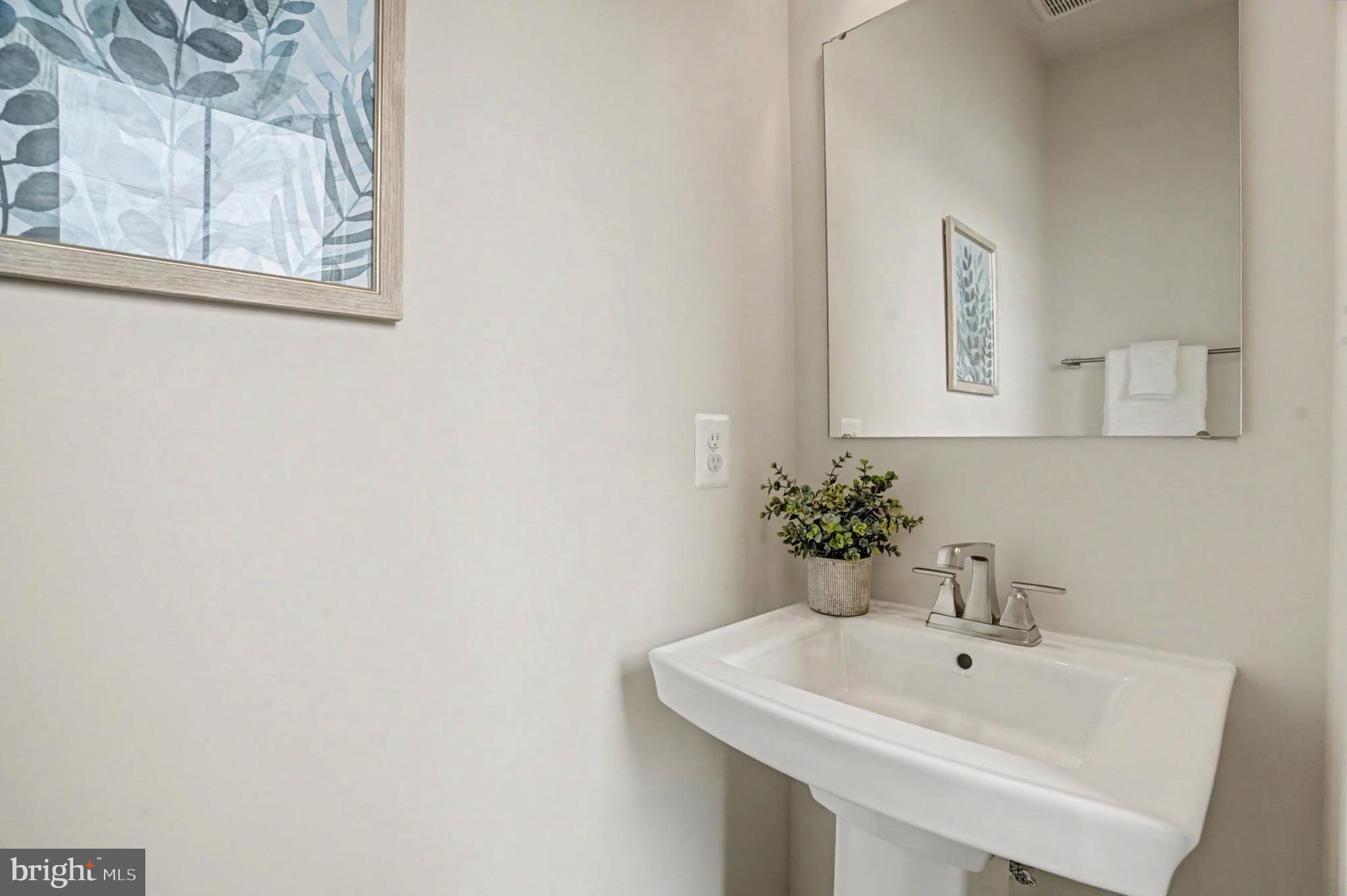 1518 Decatur Street, Unit C Baltimore, MD 21230 - Photo 23 of 42 a white sink sitting next to a white sink