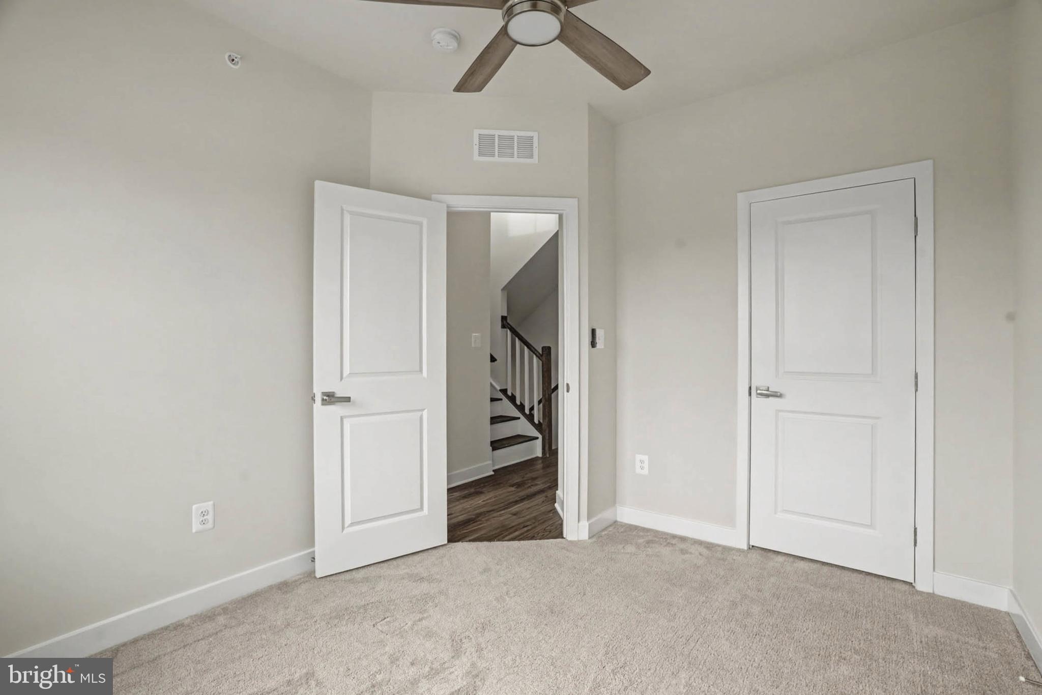 1518 Decatur Street, Unit C Baltimore, MD 21230 - Photo 25 of 42 an empty room with closet and a chandelier fan