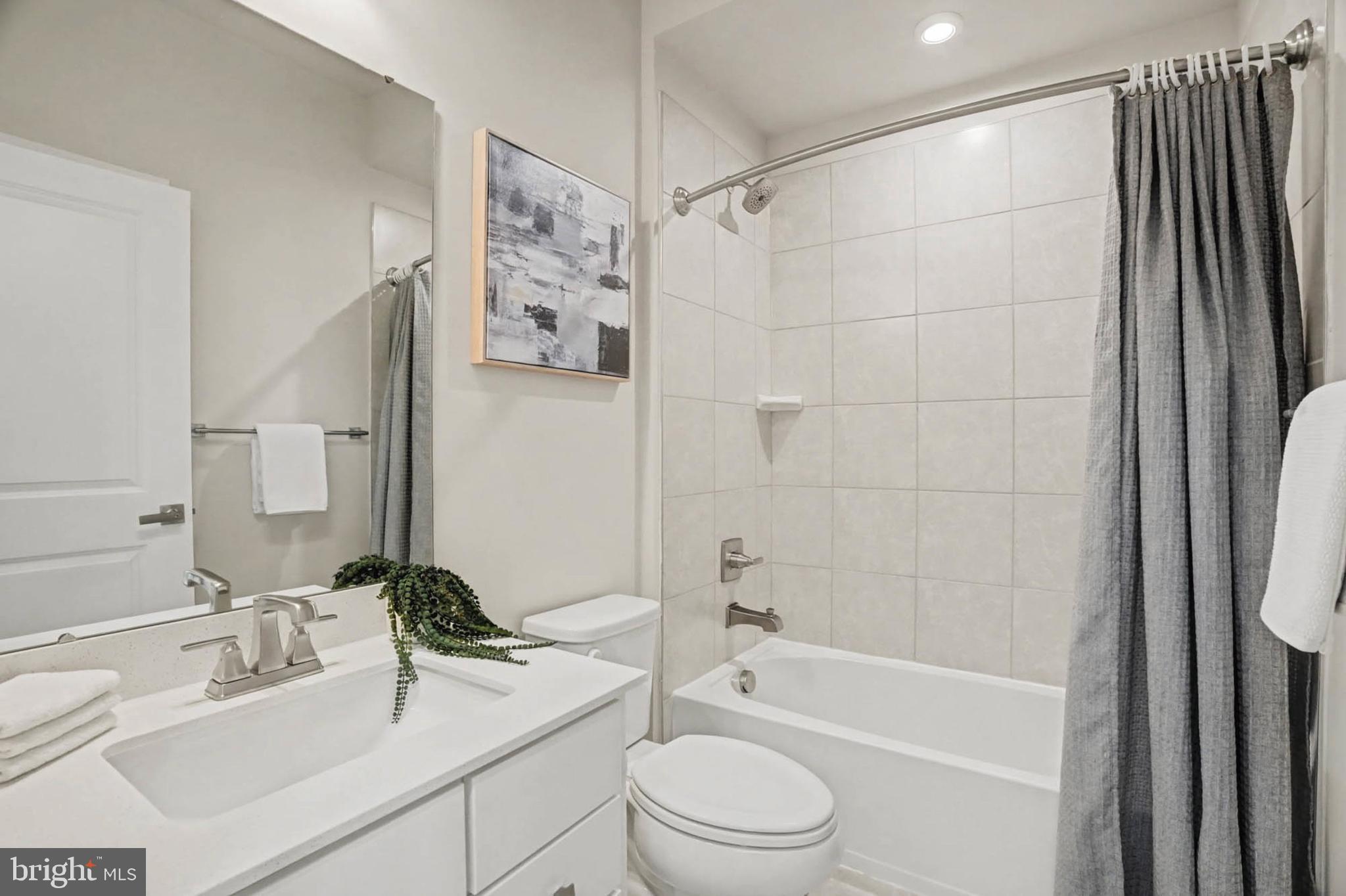 1518 Decatur Street, Unit C Baltimore, MD 21230 - Photo 26 of 42 a bathroom with a sink a toilet and shower