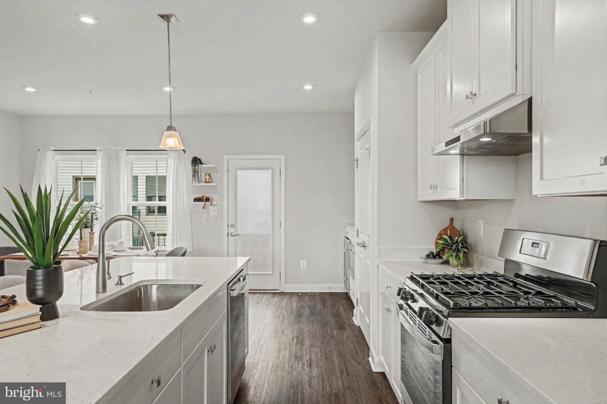 1518 Decatur Street, Unit C Baltimore, MD 21230 - Photo 8 of 42 a kitchen that has a sink a stove and cabinets