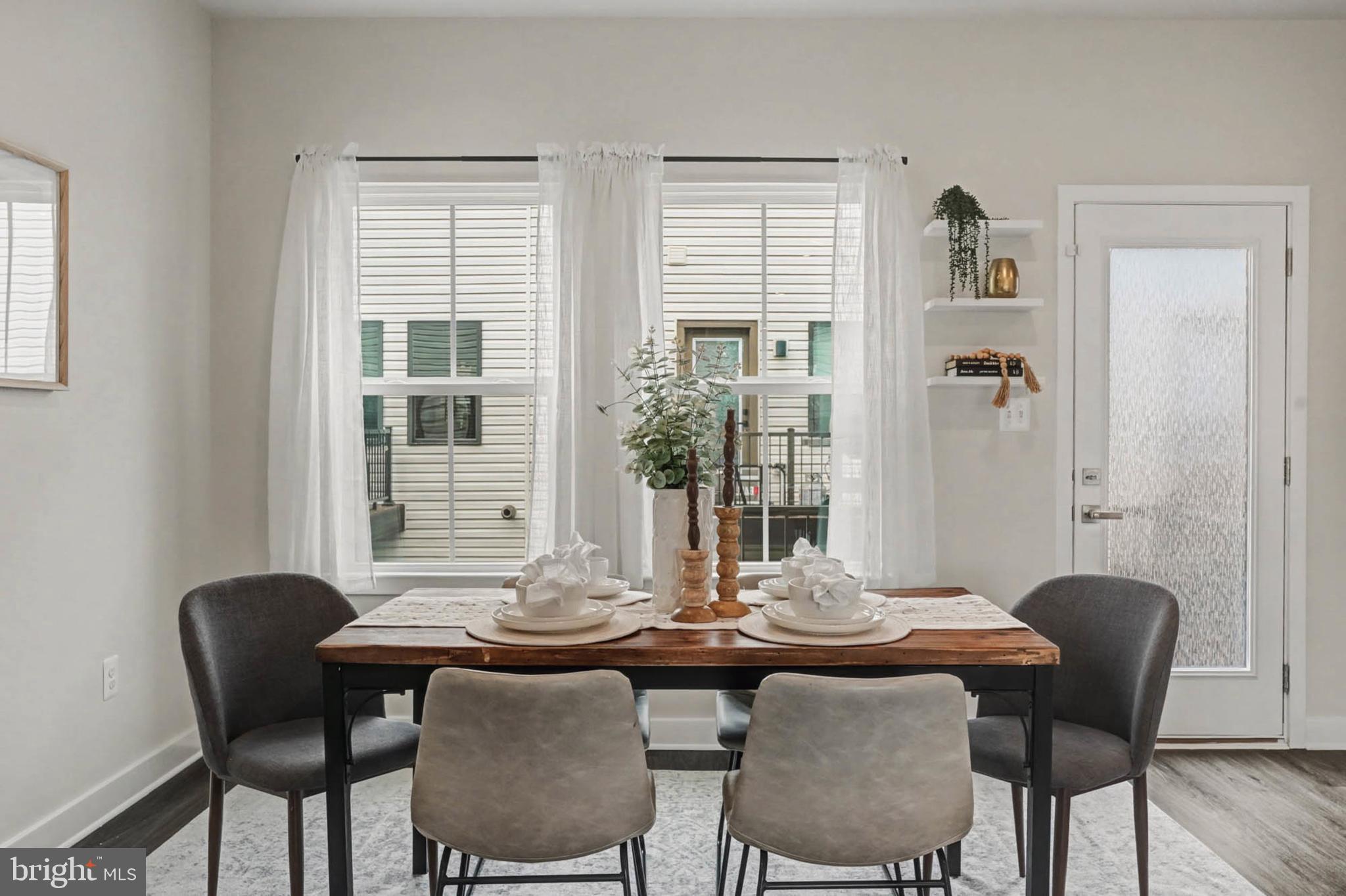 1518 Decatur Street, Unit C Baltimore, MD 21230 - Photo 9 of 42 a view of a dining room with furniture and window