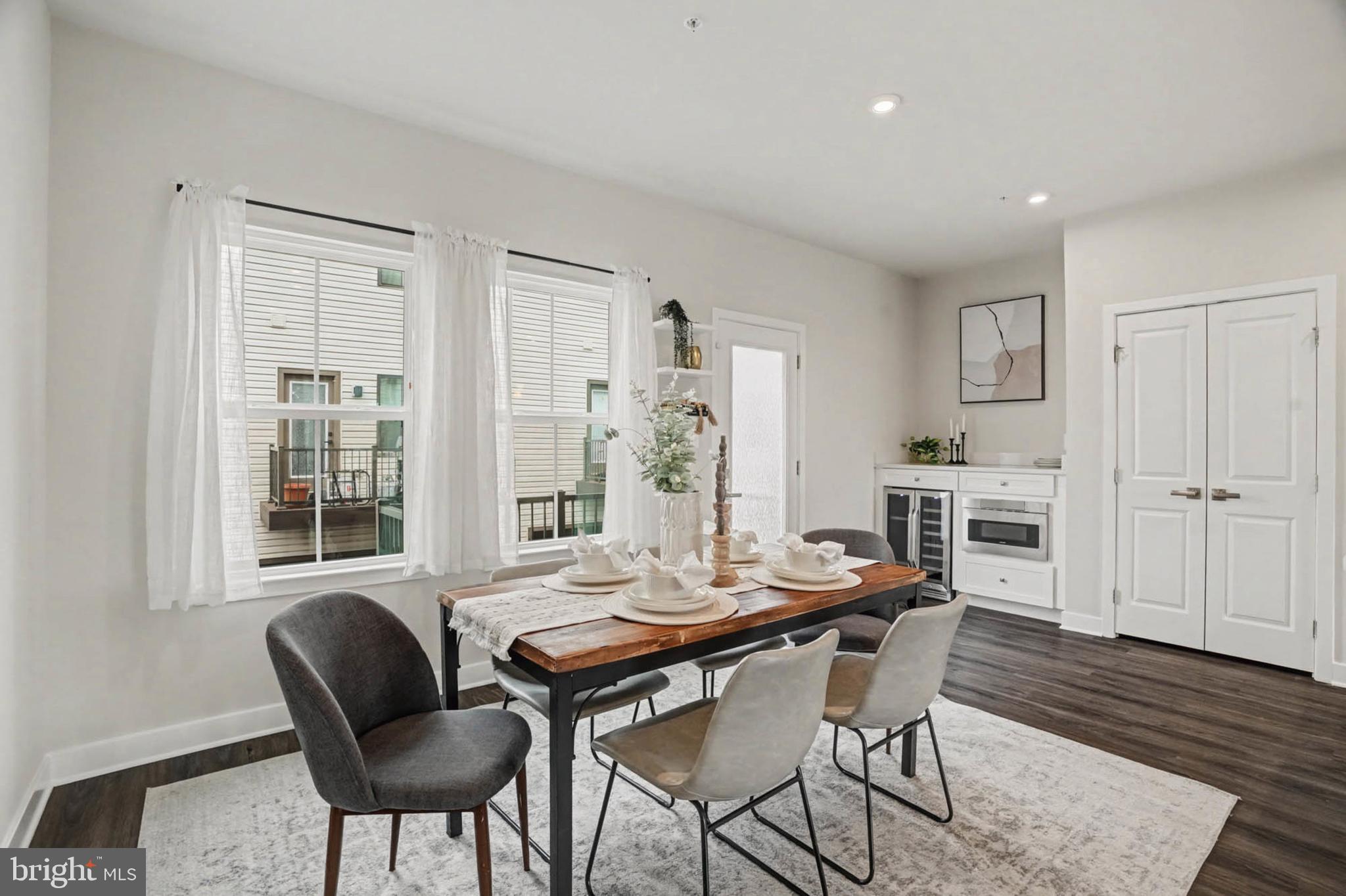 1518 Decatur Street, Unit C Baltimore, MD 21230 - Photo 10 of 42 a view of a dining room with furniture window and wooden floor