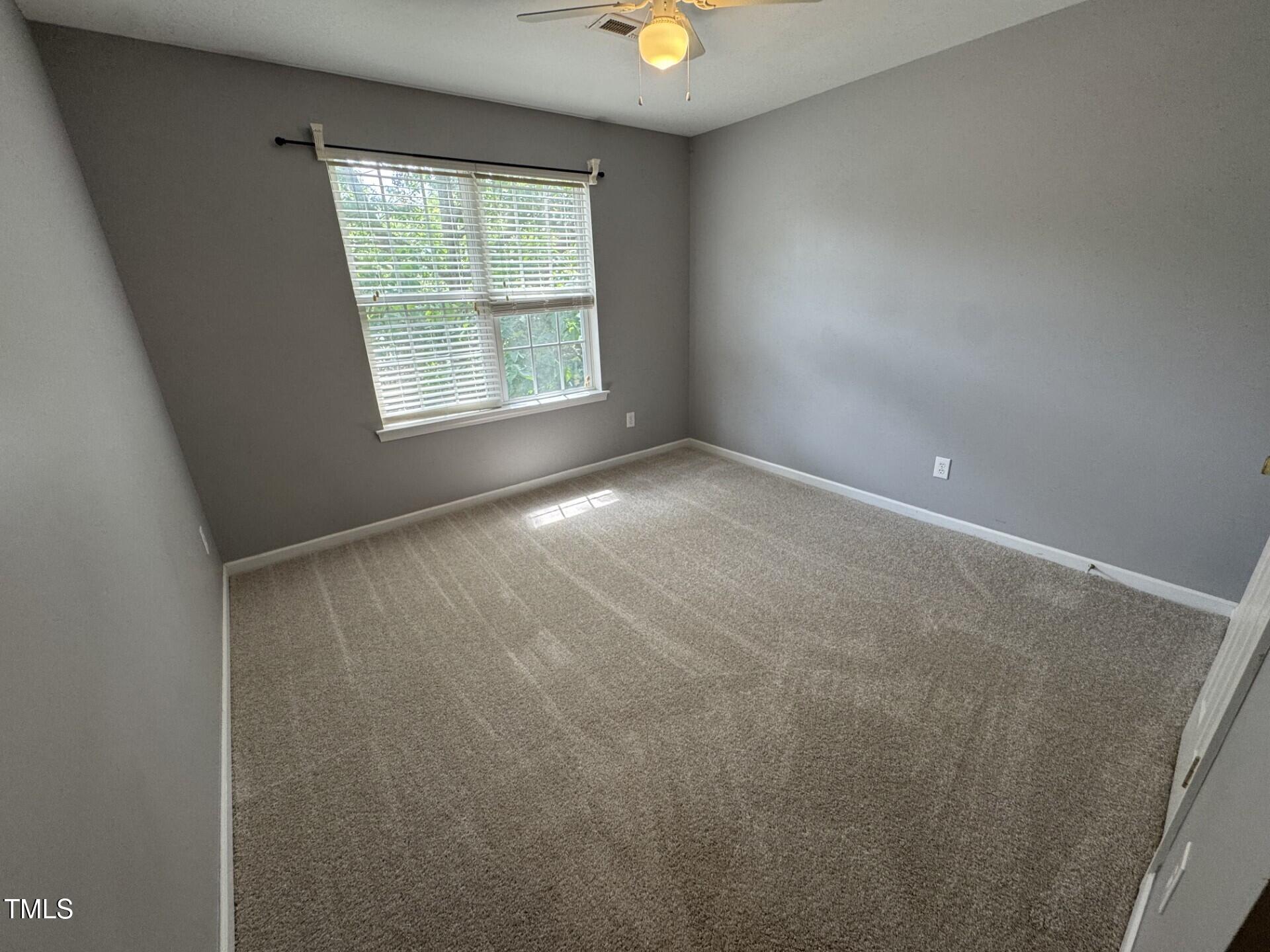 2250 Plum Frost Drive Raleigh, NC 27603 - Photo 14 of 19 an empty room with windows and closet