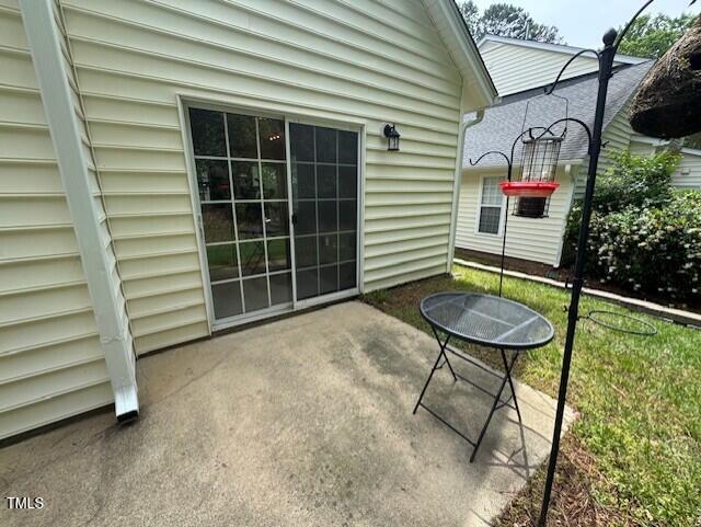 2250 Plum Frost Drive Raleigh, NC 27603 - Photo 17 of 19 a backyard of a house with table and chairs