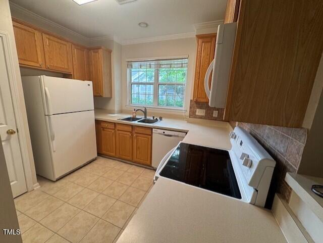 2250 Plum Frost Drive Raleigh, NC 27603 - Photo 6 of 19 a kitchen with a sink a refrigerator a window and red cabinets