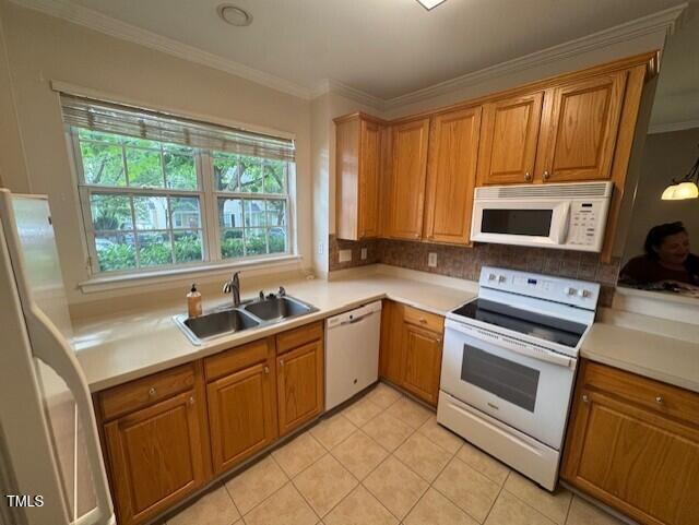 2250 Plum Frost Drive Raleigh, NC 27603 - Photo 7 of 19 a kitchen with a stove a sink and a microwave