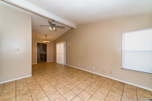 a view of an empty room and window