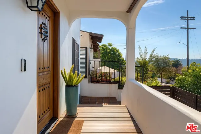 a view of a balcony with chairs