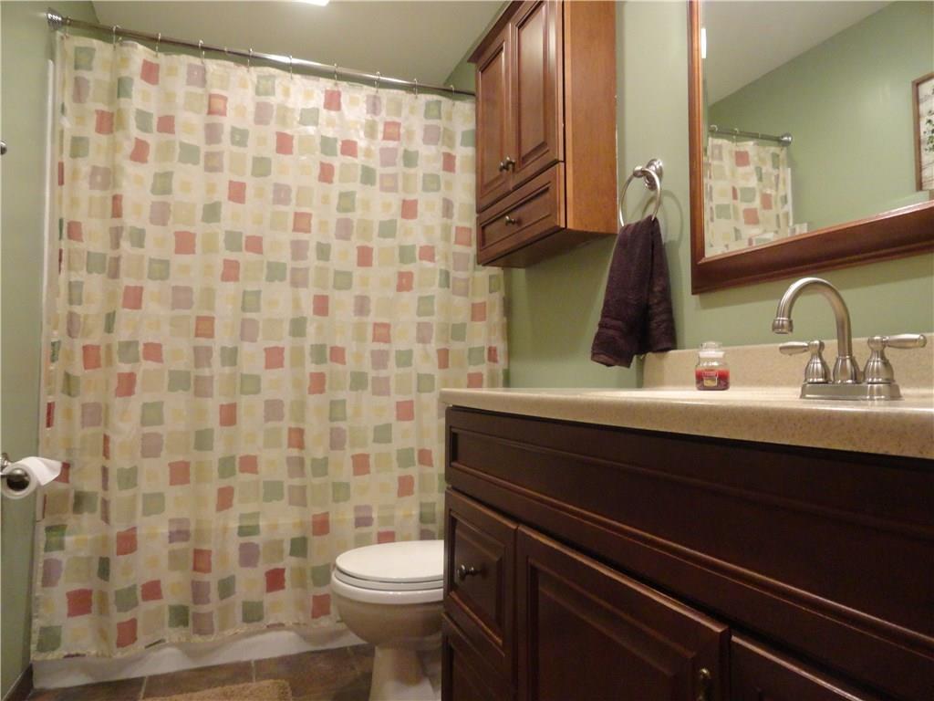 226 Oak Road Pittsburgh, PA 15239 - Photo 16 of 25 The main level full bath features updated tub/surround, updated commode and nearly 4 foot long updated vanity.