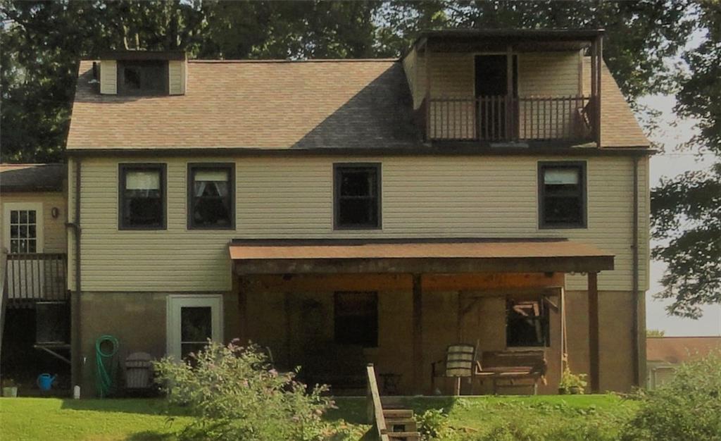 226 Oak Road Pittsburgh, PA 15239 - Photo 22 of 25 The rear side of the house features the large covered patio accessed from either the lower level Game Room OR the main level kitchen. Also shown on the right is the upper level master bedroom balcony. COME ENJOY!