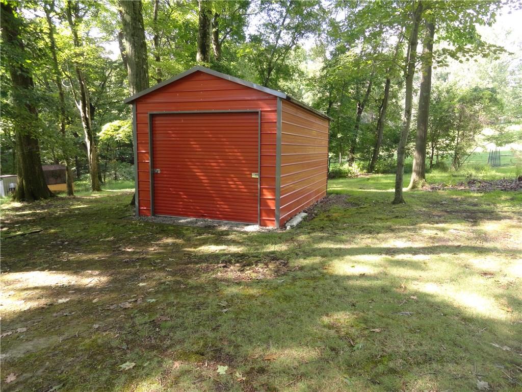 226 Oak Road Pittsburgh, PA 15239 - Photo 24 of 25 This GIANT Shed is located at the end of the property and currently houses a riding mower and recreation vehicles. There is also a man door on the opposite side (not shown).