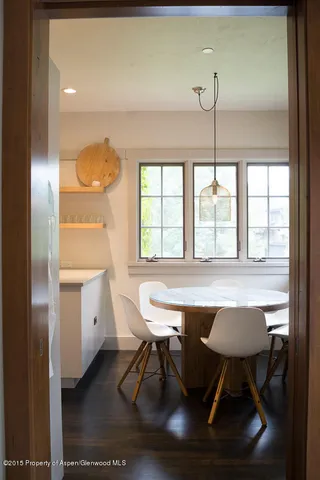 a dining room with furniture and window