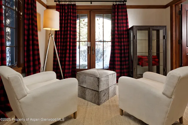 a bedroom with furniture and a window