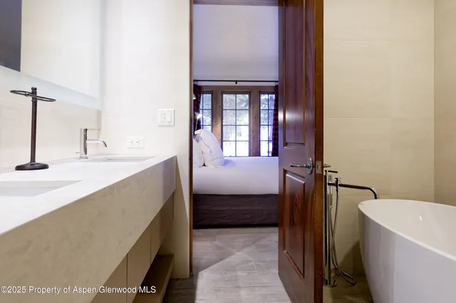 a bathroom with a sink a toilet and a tub