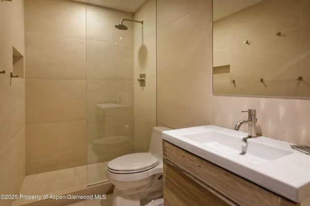 a bathroom with a bathtub and shower