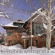 a front view of a house with yard