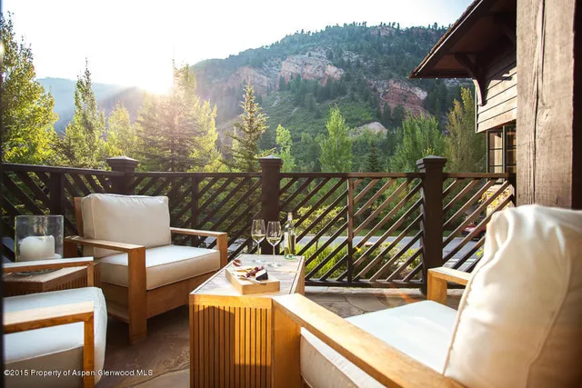 a view of a chairs and table in the terrace