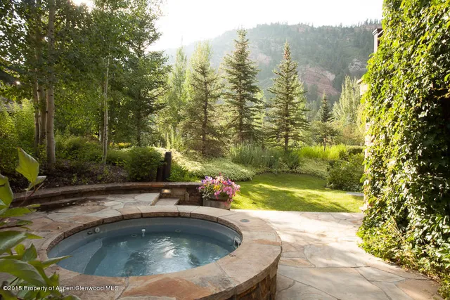 a view of swimming pool from a yard