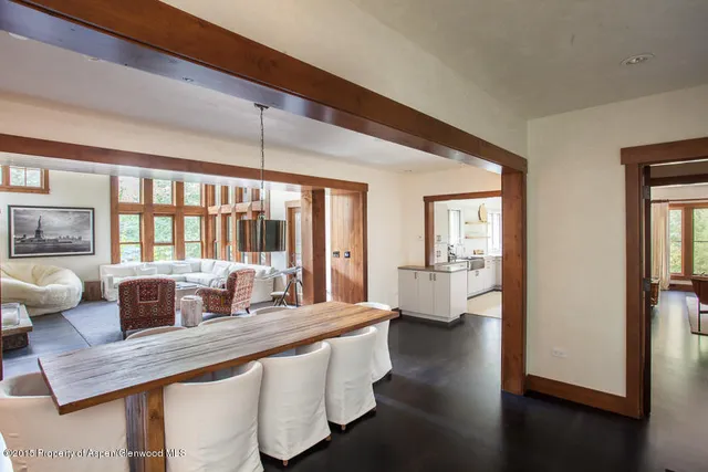 a large living room with furniture and a window