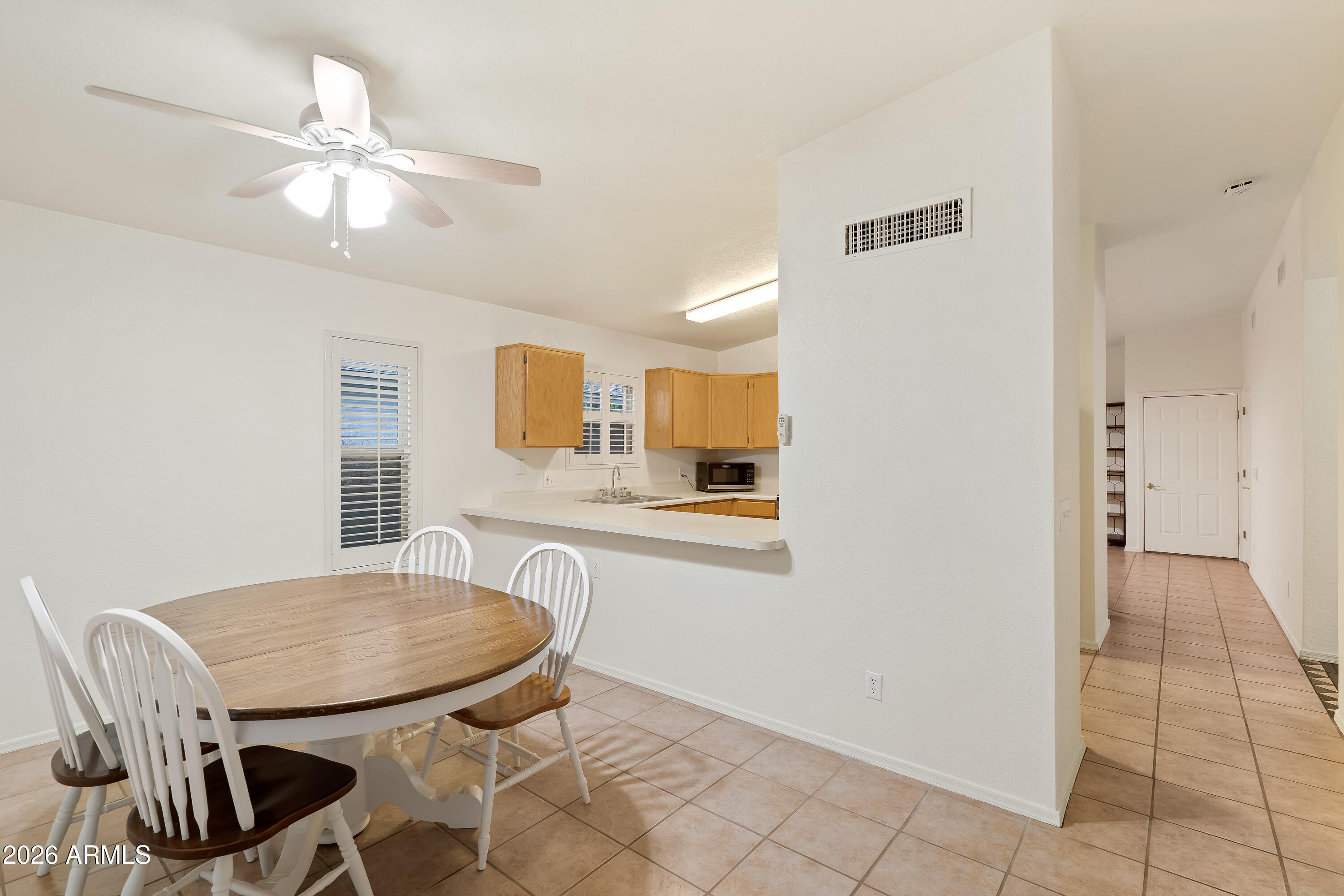 4591 Territorial Loop Sierra Vista, AZ 85635 - Photo 12 of 27 a view of a dining room with furniture and wooden floor
