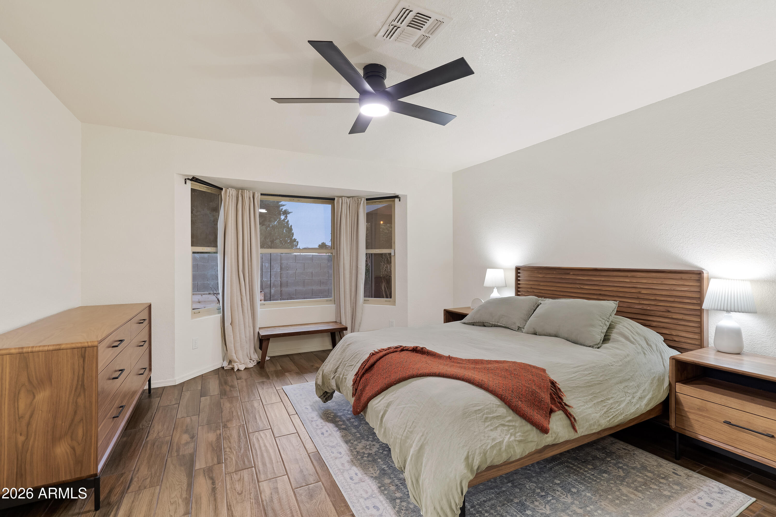 4591 Territorial Loop Sierra Vista, AZ 85635 - Photo 14 of 27 a bedroom with a bed and a large window
