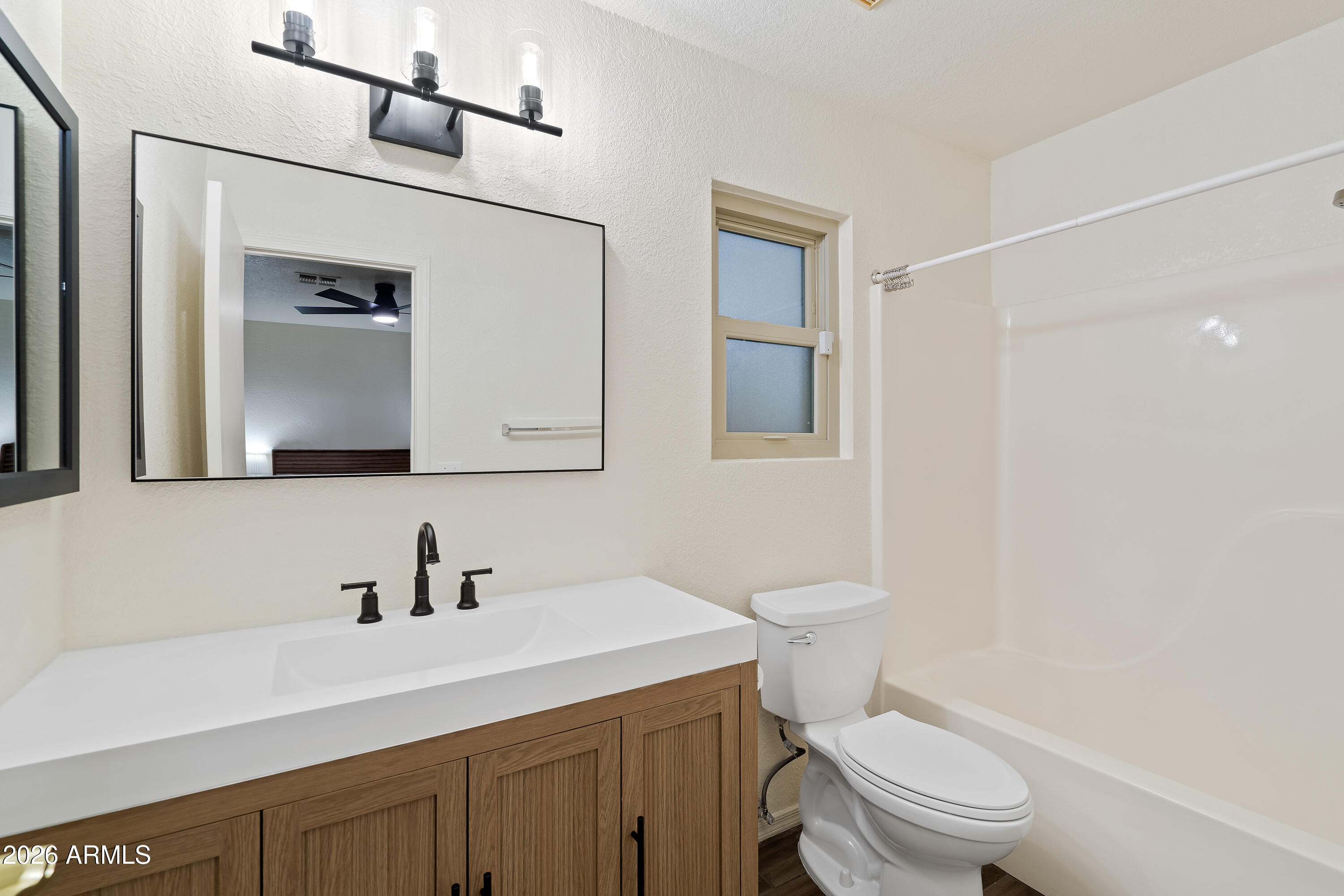 4591 Territorial Loop Sierra Vista, AZ 85635 - Photo 16 of 27 a bathroom with a sink a toilet and shower